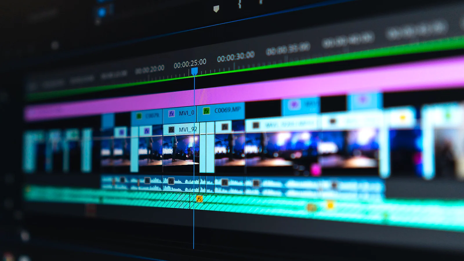 Close-up of a video timeline with layered clips and audio tracks